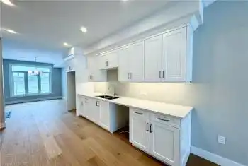 Open concept floor plan with 9 foot ceilings, hardwood floors and Quartz counter tops